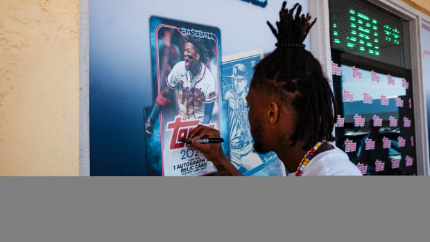 Ronald Acuña Jr. signing at a Fanatics event.